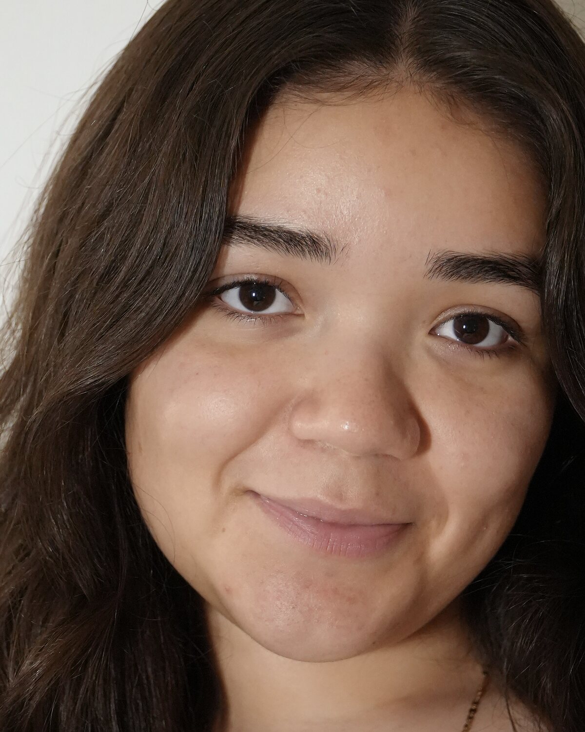 Client's skin before her facial, shown on the left