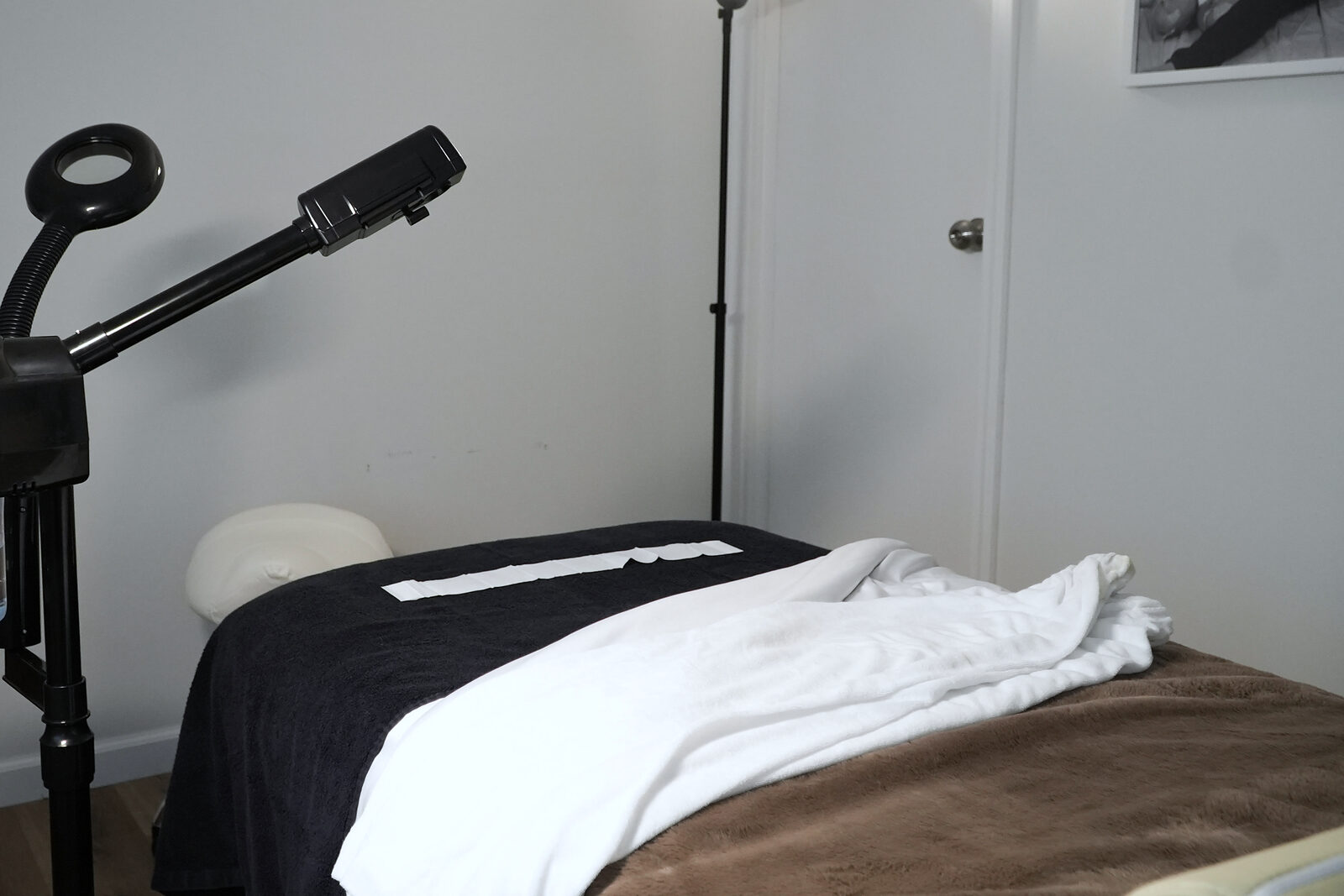 The NKD SKN treatment room, bed dressed and equipment ready